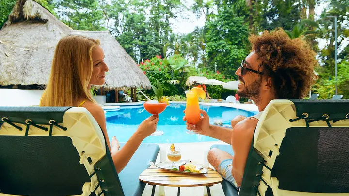 Enjoying drinks by the pool